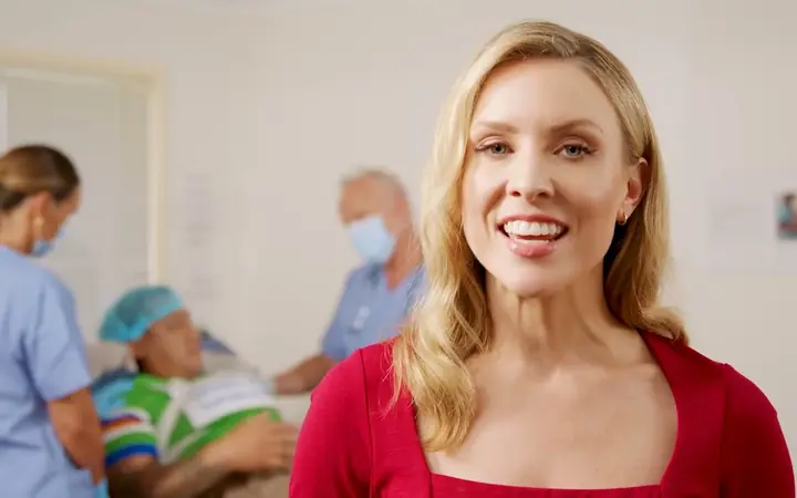A patient in hospital with doctors, from our medical negligence video